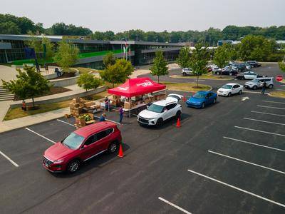 An overhead view of the cars lined up during a recent Cuyahoga County Public Library and Greater Cleveland Food Bank food distribution event.
