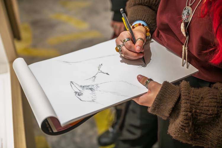 A student sketches some ideas for a avian biomimicry project.