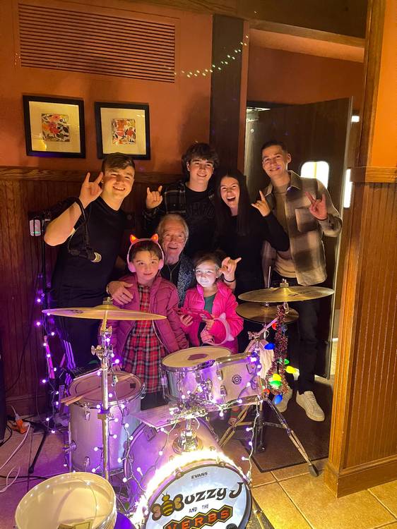 Nine months before the transplant in Tim Tench's concert with his grandchildren.