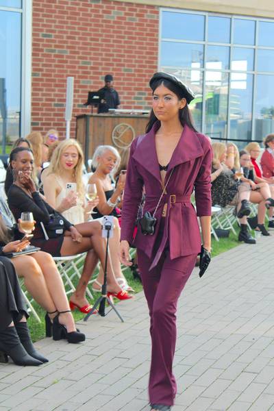 A model walks the runway, showing off some of Mayén's newest designs.