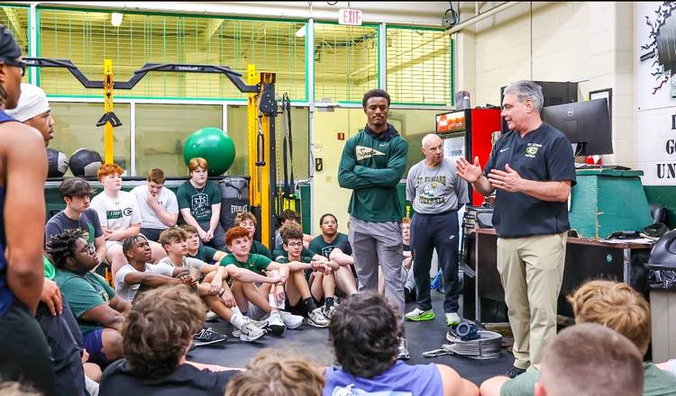 St. Edward High School head football coach Tom Lombardo and alumnus Montorie Foster Jr. work with the Eagle varsity team during the 2025 season.