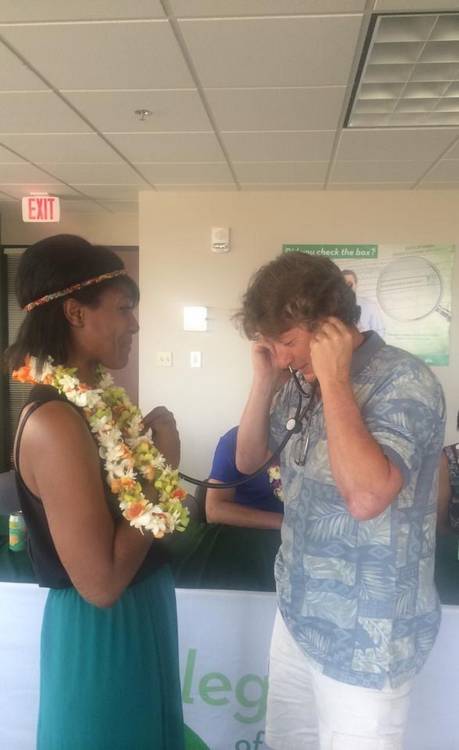 Chuck Roberts listens to the beat of his daughter's donor heart inside Candice Monroe.