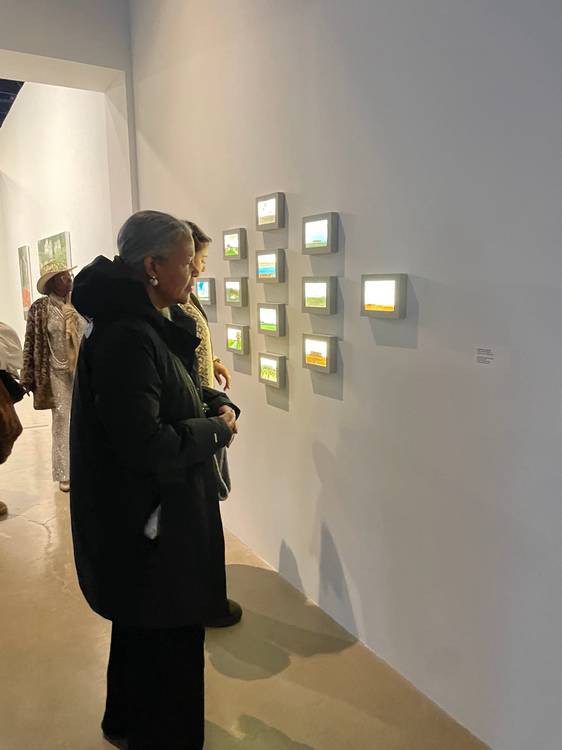 Guests mingle and study the four exhibits at moCa's recent 2026 season opening event.