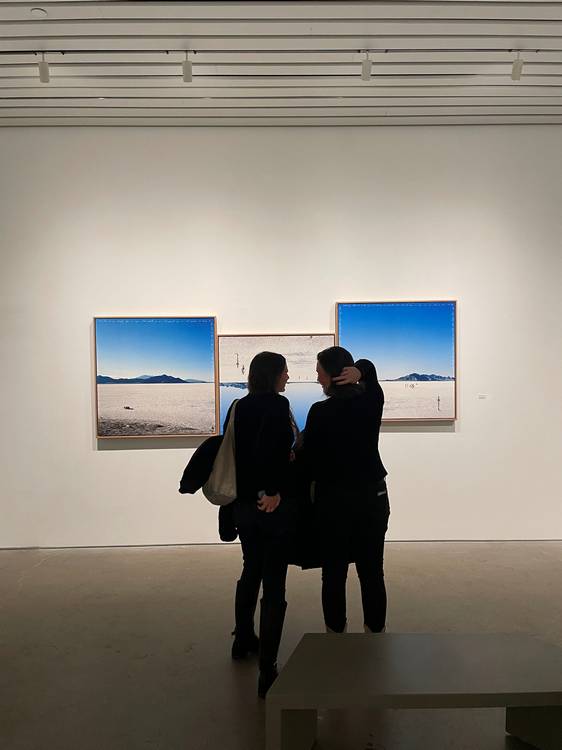 Guests socialize and study the four exhibits at moCa's recent 2026 season opening event.
