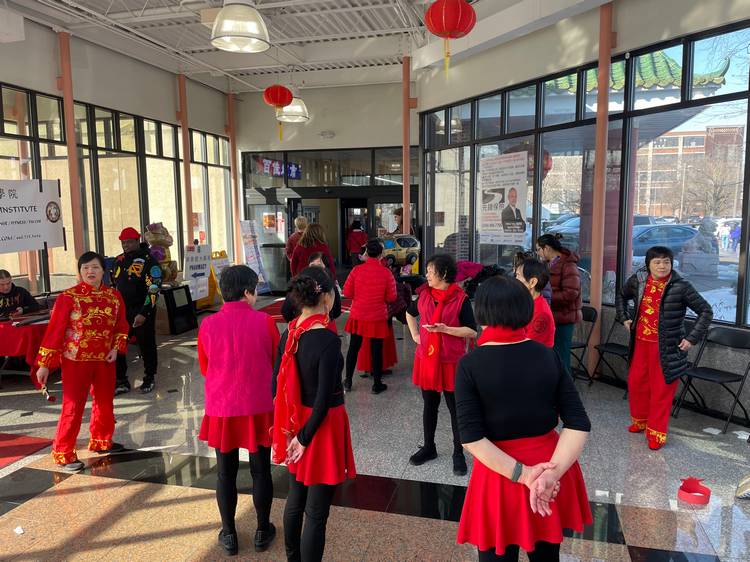 Performers warm up before a demonstration at Asia Plaza.