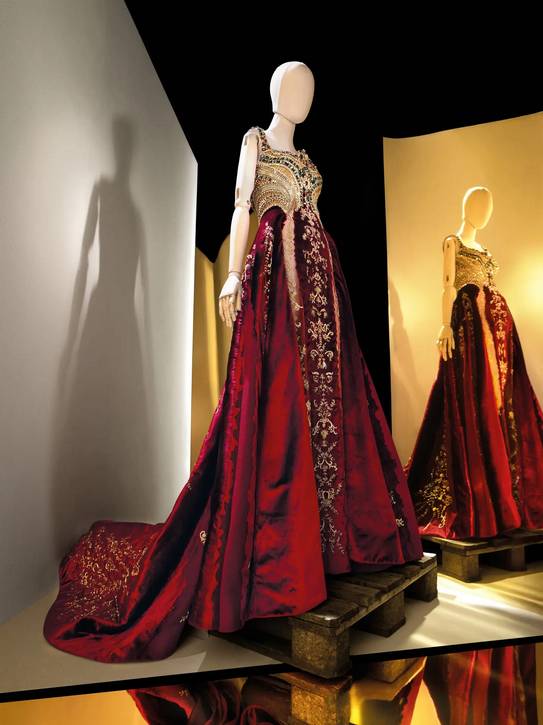 2018 Donatella Versace Silk velvet, gown with multicolored gems, beading, sequins, Swarovski crystals , and gold and silver metallic thread.