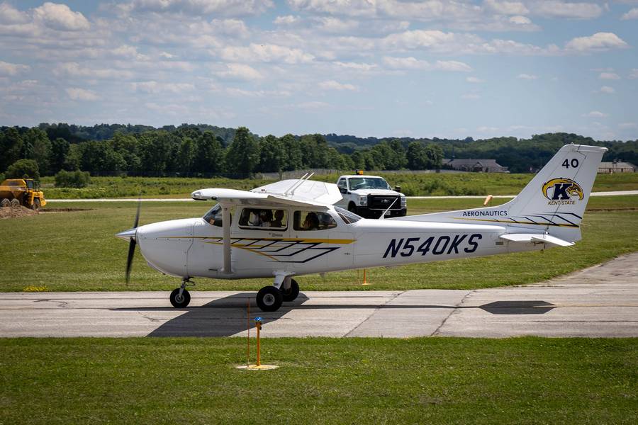 An aircraft taxis down the runway at Burke Lakefront Airport.