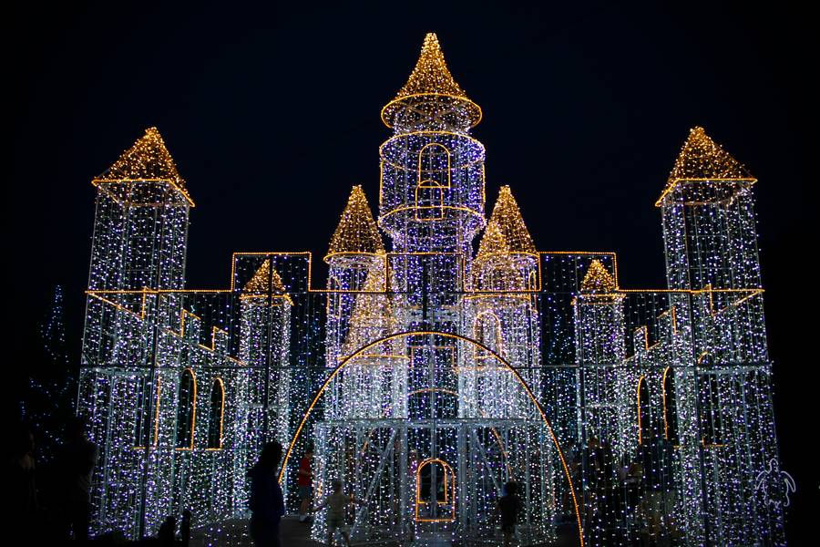 They're not just lanterns! String lights illuminate a section of the zoo, with a four-story castle as the main attraction.
