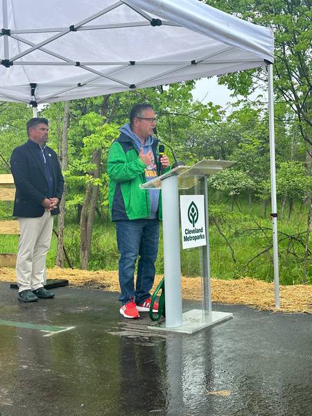 Parma Mayor Timothy DeGeeter speaks during the West Creek Greenway trail opening ceremony.