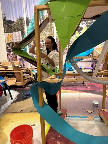 Volunteers put the finishing touches on the Parade the Circle art projects.