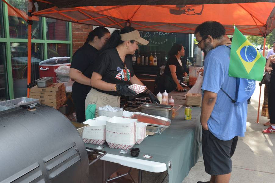 Tasting the food at at Larchmere PorchFest.
