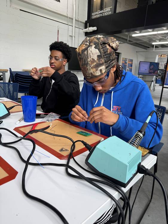 MAGNET Summer Manufacturing Academy students Bryce Brown, left, and Sethe Johnson, take part in a soldering course in the advocacy group’s headquarters in Hough.