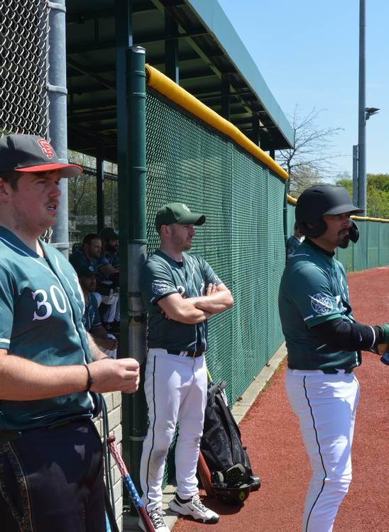 Members of the Forest City Baseball Club watch the game at League Park.