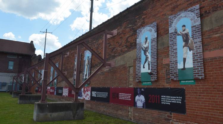 The history of League Park players on the outfield wall.