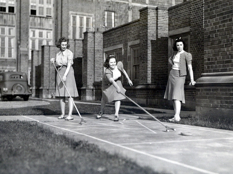 Notre Dame College students fin the 1940s enjoy a spirited game of shuffleboard, forging friendships that continued through the decades.