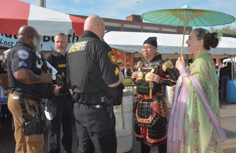 Cosplay characters meeting the local authorities.