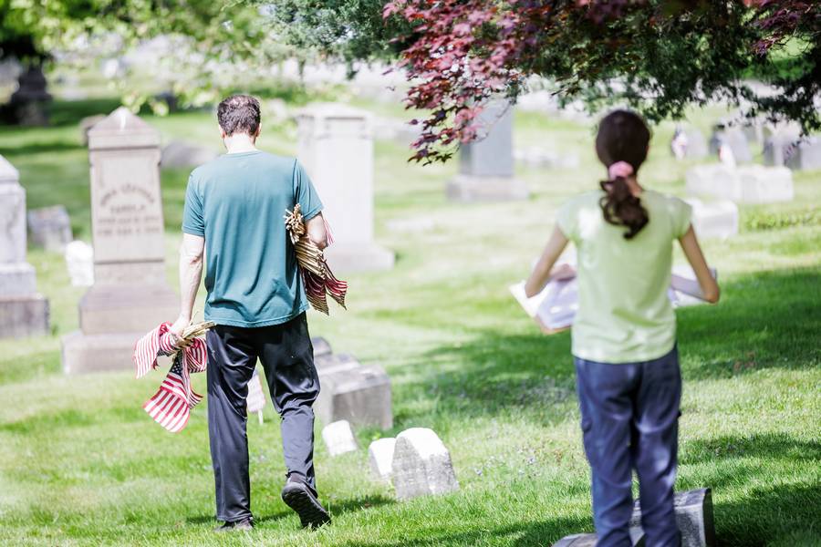 Volunteers will place flags at the graves of 9,000 veterans at Lake View Cemetery.