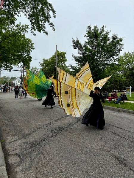 A pair of costumed parade participants.