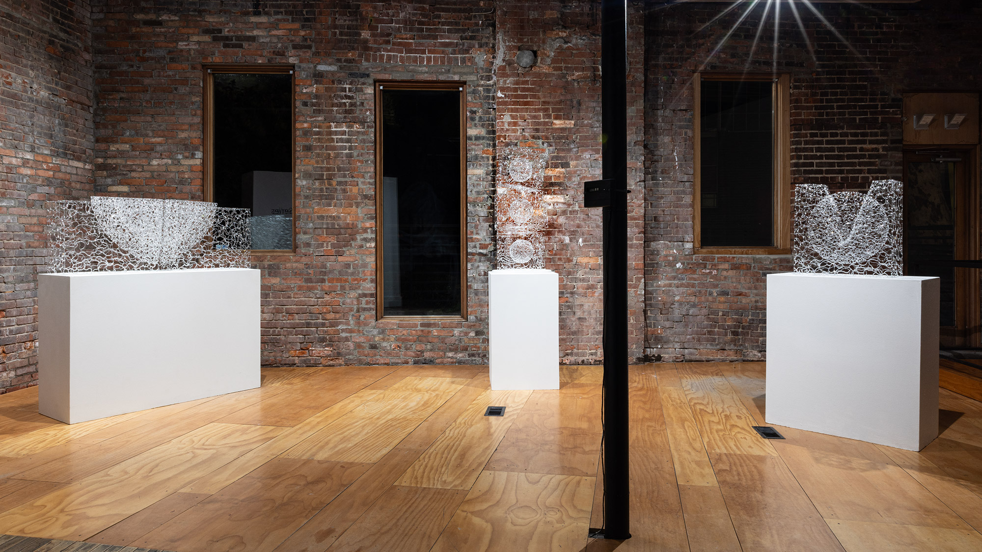 Young's work investigates the ambiguous nature of glass and its ability to create shifting perceptions of space, volume, and light.