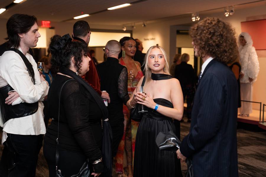 Models wear feather-inspired designs for 'Fashion & Feather,' a collaboration between the Cleveland Museum of Natural History and Kent State University.