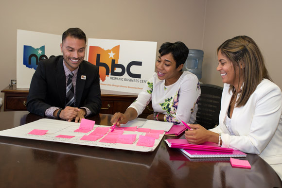 Jason Estremera working with Amber and Rachel of Pink Java at the Hispanic Business Center