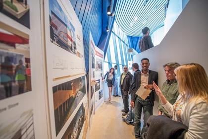 Current CIA senior Interior Architecture student Quentin Spencer showing his designs to visitors at the 2014 Spring Design Show