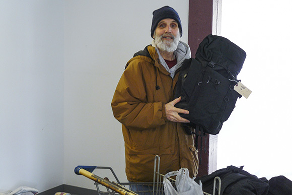 Jim Schlecht, outreach worker for NEOCH, taking donated items out to homeless people in Cleveland