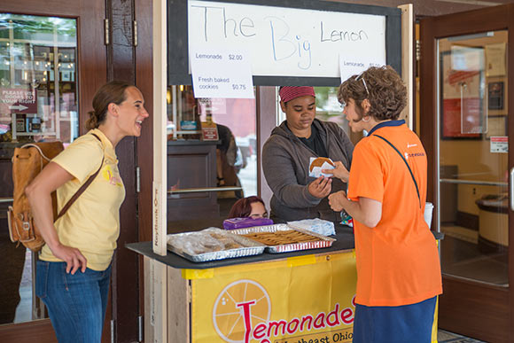 Student entrepreneurs lemonade stand outside the Capitol Theatre