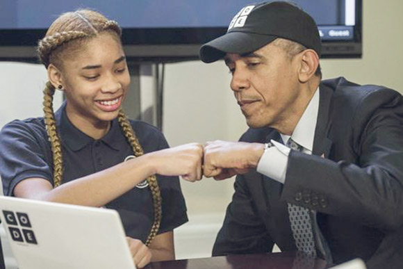 President Obama with a middle school student in an Hour of Code Event put on by Code.org at the White House in 2014 
