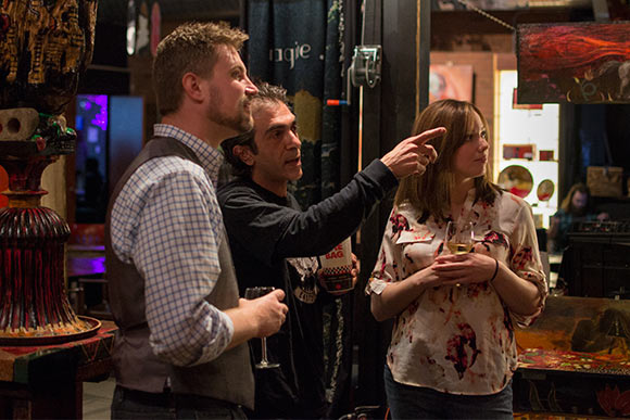 Gadi Zamir talks with visitors to his Negative Space Gallery