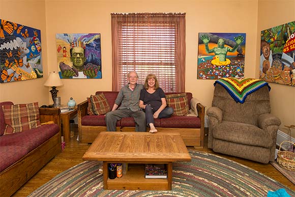 Gary and Laura Dumm at their home surrounded by "Monsters"