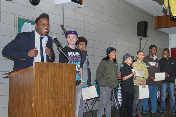 Ja’Ovvoni Garrison hosting the award ceremony for the Skaters Next Door program in 2011 at the Annual Neighborhood Summit in Slavic Village