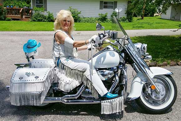 A recent client's bike dressed with custom bags, floorboard fringe, & seat