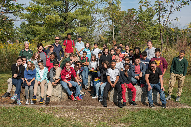 Cousteau posing with Urban Community School children