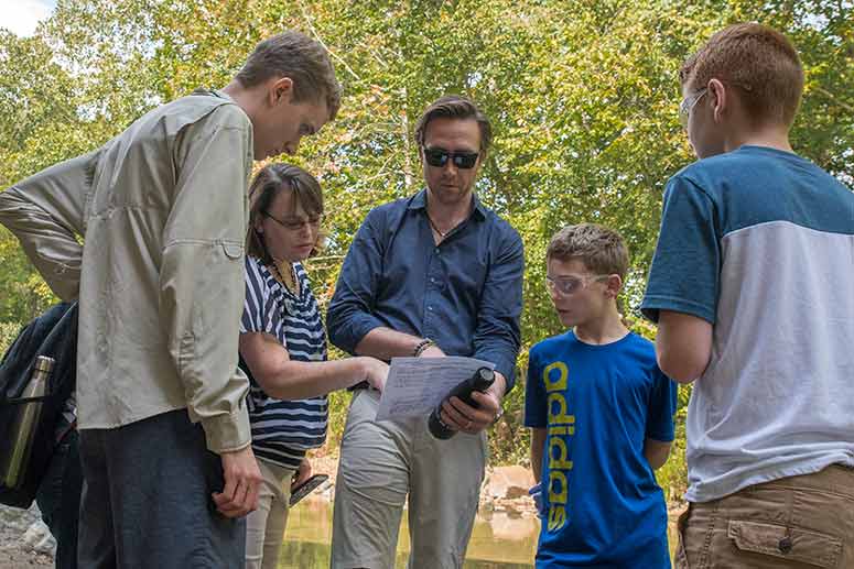 Cousteau with students water testing at the Everett Covered Bridge