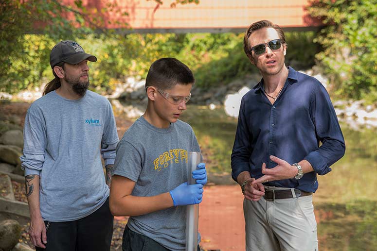 Cousteau with students water testing at the Everett Covered Bridge