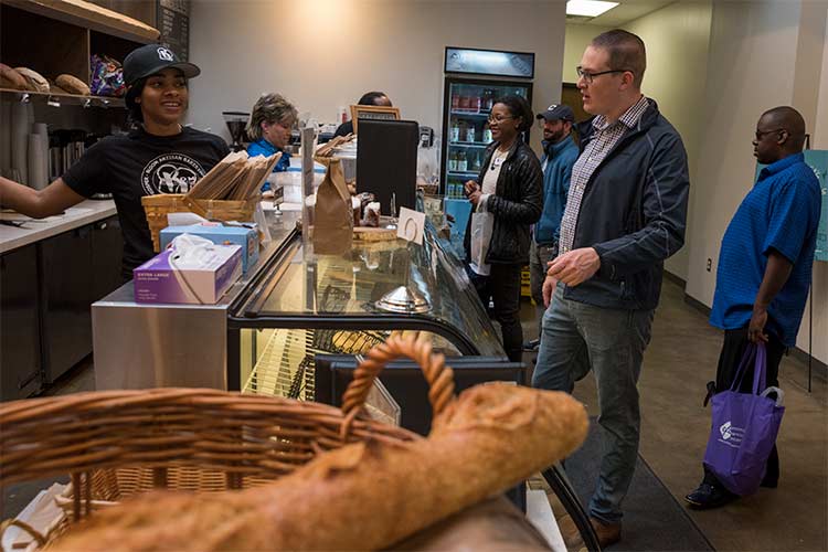 Reentry Week Cash Mob/Passport Bus Tour stop at Bloom Bakery