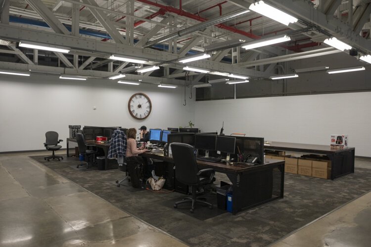 Krueger and his team decided to renovate offices that were very antiquated with drop ceilings and tiles into a more inviting space that honored the building’s rich history.