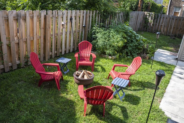 The cozy backyard fire pit and garden