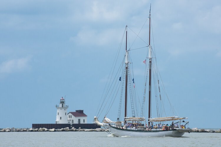The USA schooner Appledore IV out of Bay City, Michigan near the lighthouse