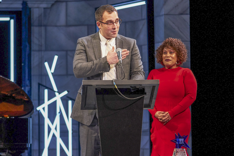 Artistic Director Nathan Motta accepting Dobama’s EDI award