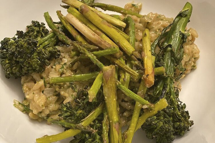Birch Café oven baked pesto risotto topped with roasted broccolini and asparagus