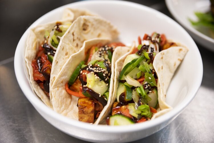 Foodhisattva’s Seoul Tacos with Korean BBQ tofu and The True Tacos with taco crumble, and cashew cheese.