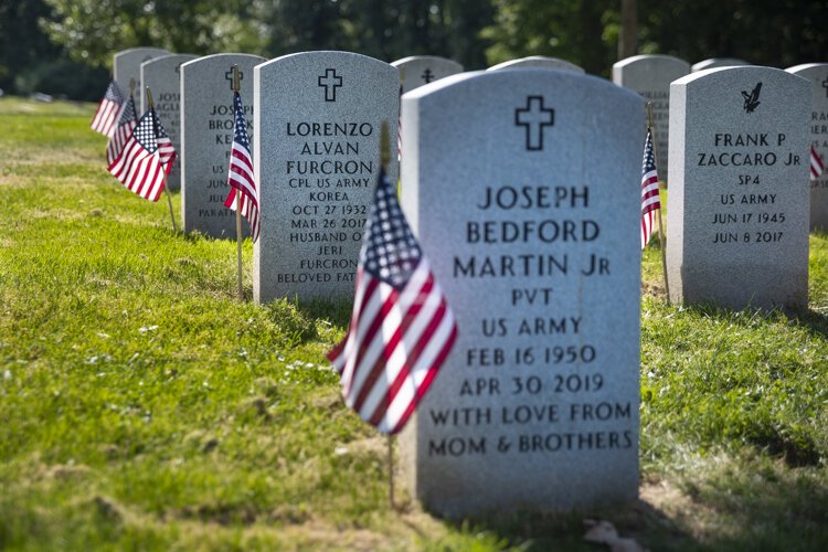 U.S. military veterans receive a free plot in a special section of Lake View, complete with the same grave markers found at Arlington National Cemetery in Virginia.