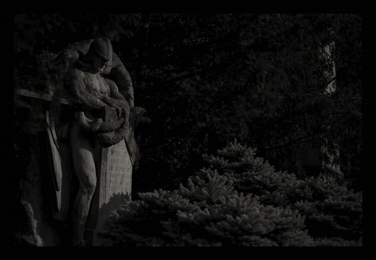 "As If We Were God's Spies" is a photo from "Moonlight in the Gates: 150 Years of Lake View Cemetery in a New Reflective Light,” an outdoor exhibit by Michael Weil.