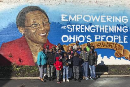 October, the artist Kevin “Mr. Soul” Harp and his colleague Sano painted a mural of UMDC founder Inez Killingsworth welcoming people to the neighborhood at 13014 Miles Ave. 