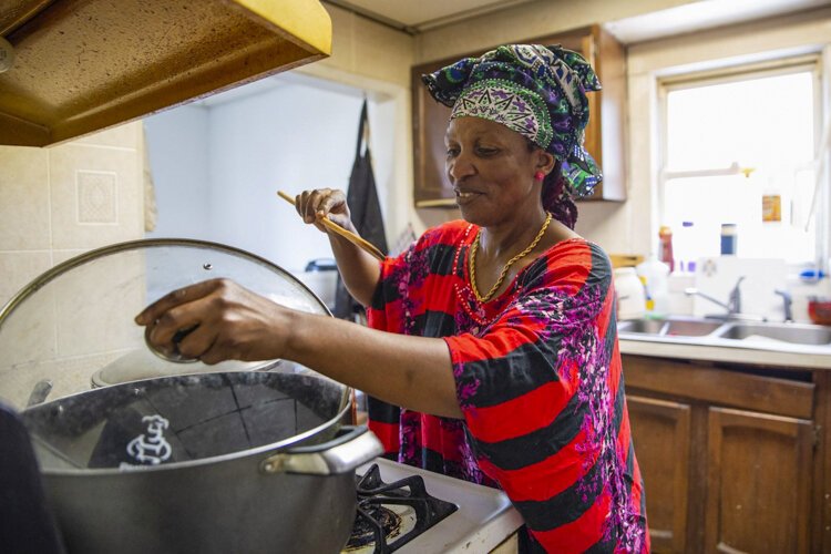 Innette Malumalu cooks for a community event from her home kitchen.