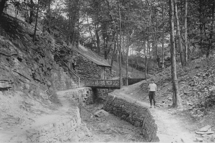 Creek Behind Deming House, 1914, showing stone retaining walls that were built to control the creek that runs behind the Deming House. 