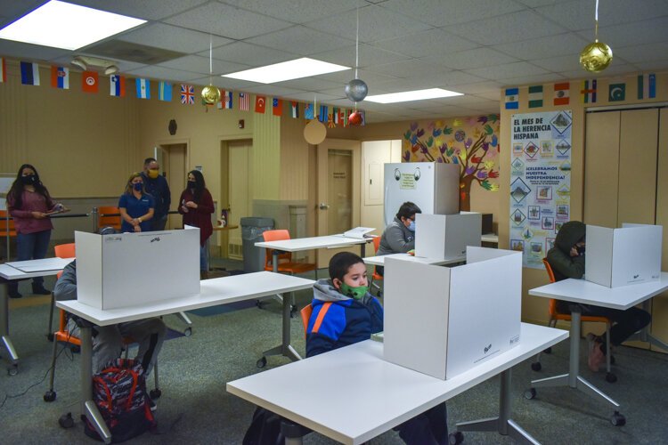 A small group of Hispanic CMSD students attend their virtual-only classes inside the Cleveland nonprofit Esperanza, Inc’s offices.