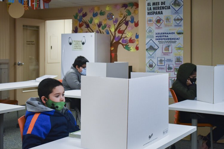 A small group of Hispanic CMSD students attend their virtual-only classes inside the Cleveland nonprofit Esperanza, Inc’s offices.